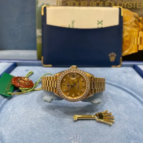 Rolex Lady-Datejust 69138 26mm Yellow gold Champagne