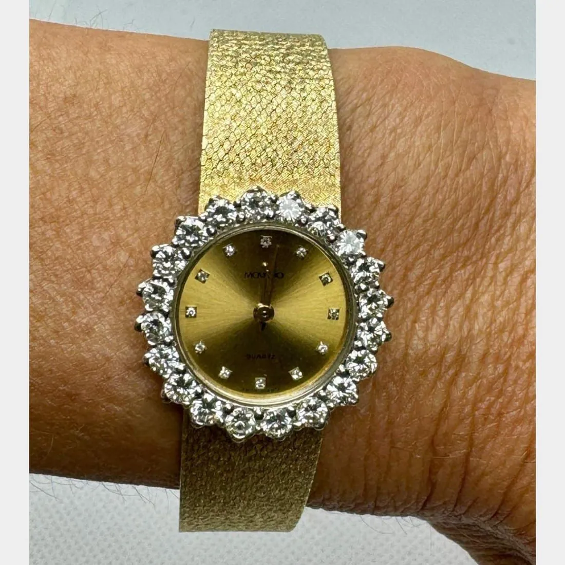 Movado 24.3mm Yellow gold and diamond