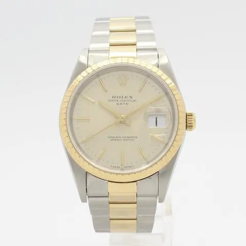 Rolex Oyster Perpetual Date 15223 34mm Yellow gold and stainless steel Champagne