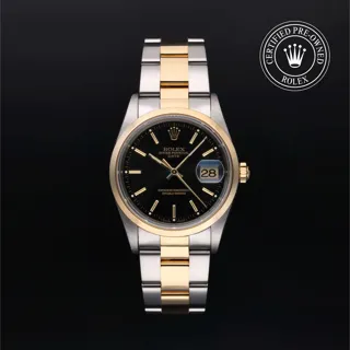 Rolex Oyster Perpetual Date 15203 Yellow gold and Oystersteel Black