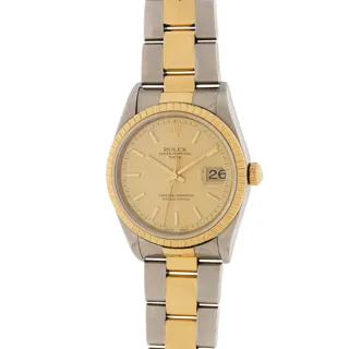 Rolex Oyster Perpetual Date 15223 Stainless steel and 18k yellow gold Champagne