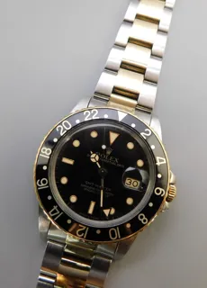 Rolex GMT-Master 16753 Yellow gold and Stainless steel Black