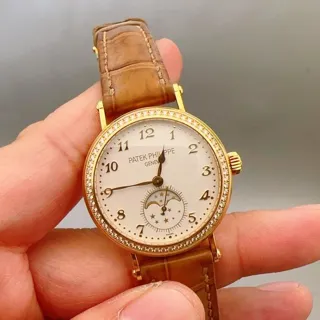 Patek Philippe Moonphase 7121J-001 33mm Yellow gold White