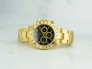 Rolex Daytona 16528 Yellow gold Black