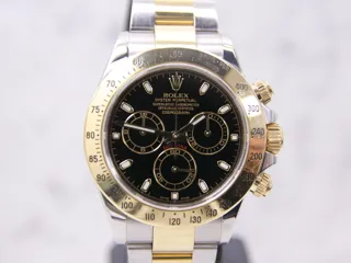 Rolex Daytona 116523-0039 Yellow gold and Stainless steel Black