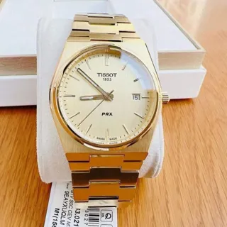 Tissot PRX T137.410.33.021.00 40mm Yellow gold and Stainless steel Champagne