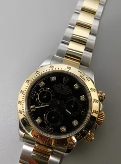 Rolex Daytona 116523-0043 Yellow gold and Stainless steel Black