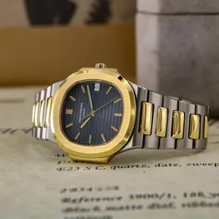 Patek Philippe Nautilus 3900/1 33mm Yellow gold and Stainless steel Black