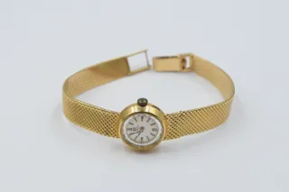 Omega 18k yellow gold Cream