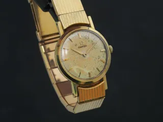 Omega 18k yellow gold Cream