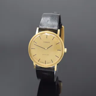 Tissot Stylist 34mm 14k yellow gold Champagne